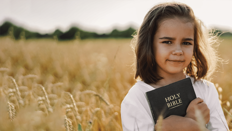 Girl holding Bible