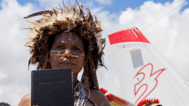 Man from the Yali tribe with Bible